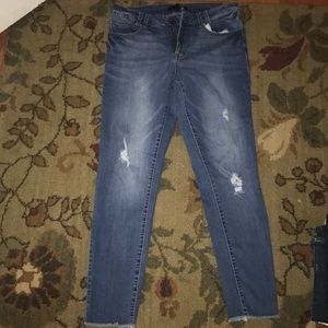 Distressed denim jeans